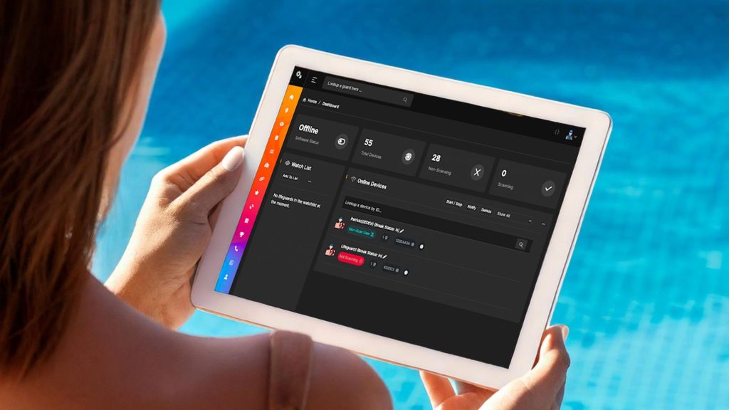 Tablet device showing alert system near pool